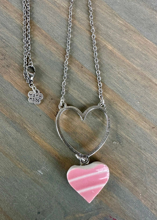 Beautiful broken china pendant necklace using a vintage Pink Fiestaware plate, on silver necklace