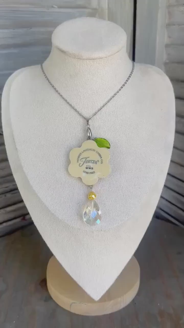 Beautiful broken china pendant necklace using a  Homer Laughlin Yellow Fiestaware plate, silver necklace, Daisy with Logo